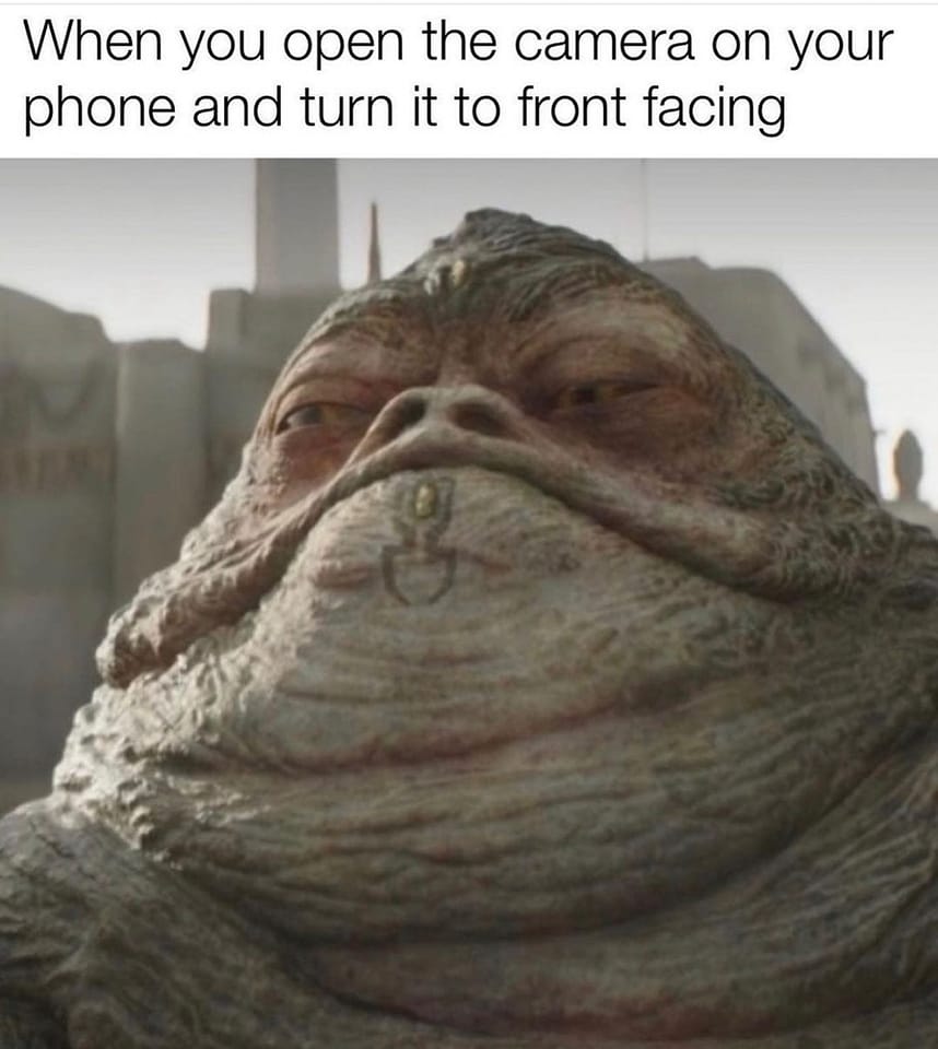 This meme is a humorous image of a character from the Star Wars franchise, specifically Jabba the Hutt, with a caption that pokes fun at the frustration of taking selfies. The text at the top of the image reads: "When you open the camera app and it's still on selfie mode". The meme is likely to resonate with people who have experienced the frustration of accidentally taking a selfie when they meant to take a photo of something else.